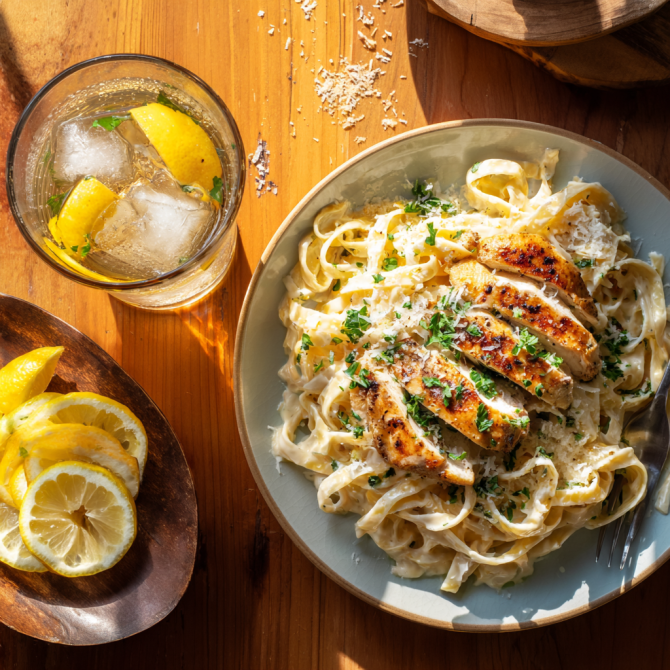 Creamy lemon chicken pasta served with Iced tea