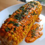 Spicy and Creamy Cajun Corn on the Cob with Zesty Toppings - Mellie Recipes