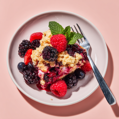 Mixed berry dump cake served for guests