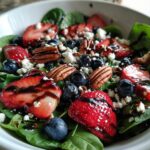 30-Minute Strawberry Spinach Salad with Blueberries, Pecans, Feta cheese, and a Balsamic glaze.